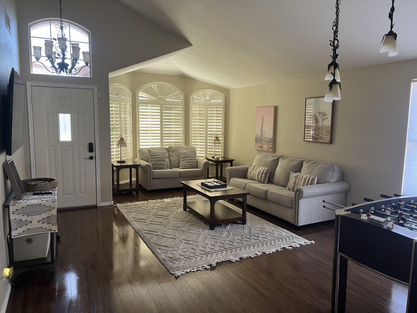 Welcoming and tidy living room showcasing standard cleaning services, featuring a neatly arranged seating area, dust-free surfaces, and a bright, orderly atmosphere, reflecting regular upkeep and cleanliness.